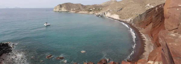 Red beach near the city of Akrotiri on Santorini island, Greece.