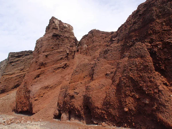Red beach near the city of Akrotiri on Santorini island, Greece.