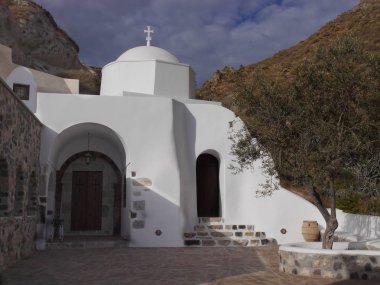 Temples and monasteries of the historical part of the Emporio, the largest village of Santorini island, Greece.