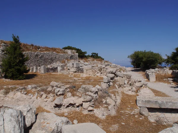 Ancient Thira (Thera) is an ancient city located on the steep rocky cape Mesa Vouno on Santorini island, Greece. The ruins of ancient buildings.