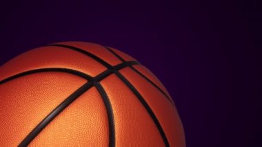 Basketbol oyunu için yavaş dönen turuncu topun animasyonu. Siyah zemin üzerinde ışık ve gerçekçi dokusu olan, pürüzsüz döngü.