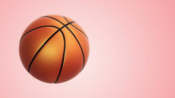 ピンクの背景にリアルな質感と光を持つバスケットボールゲームのための遅い回転オレンジボールのアニメーション シームレスなループ — ストック動画