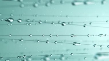 Yeşil zemin üzerinde süzülen su damlalarının soyut animasyonu pürüzsüz döngünün canlandırması
