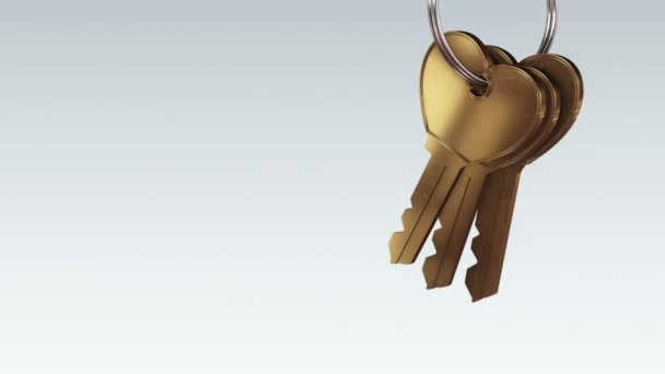 Gri Arka Plandaki Yeni Evden Gelen Altın Anahtarlarla Metalik Yüzüğün — Stok video
