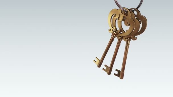 Gri Arka Plandaki Yeni Evden Gelen Altın Anahtarlarla Metalik Yüzüğün — Stok video