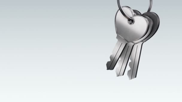 灰色背景下带银键金属环的动画化 无缝环的动画化 — 图库视频影像
