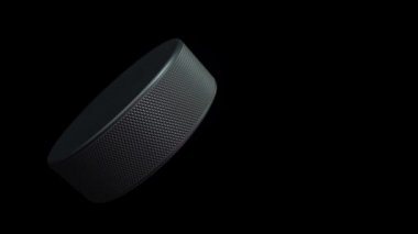 Hokey maçı için yavaş dönen diskin animasyonu. Gerçekçi dokuya ve ışığa sahip yakın çekim görüntüsü. Kusursuz döngünün animasyonu.