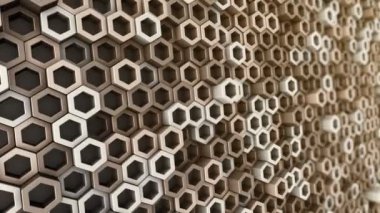 Altın altıgenlerin dalga mozaiğinin animasyonuyla soyut teknolojik arkaplan, kusursuz döngünün animasyonu.