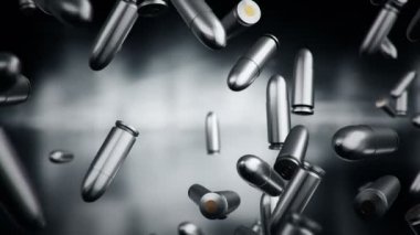 Karanlık ve bulanık arka planda farklı kalibrelerde kurşunların düşüşü. Kusursuz döngünün animasyonu.