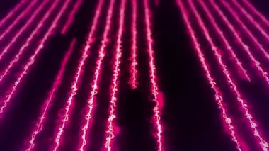 Neon çizgileri ya da lazerleri olan soyut bir arkaplan ve uçan çizgiler üzerinde titreşen parçacıklar. Kusursuz döngünün animasyonu.