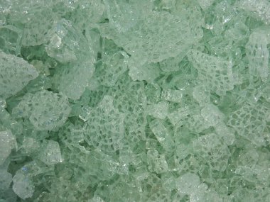 Broken glass, shards in green, abstract background clipart