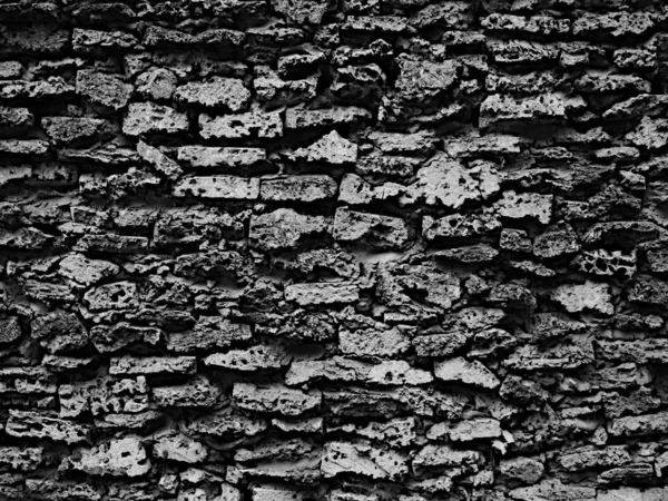 Masonry stone wall texture, background in black and white