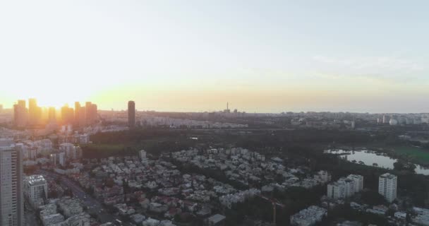 Aerial view above Tel Aviv at sunset, city in the middle east at Israel. Skyline view of modern town landscape with business district, high buildings real estate — Stock Video