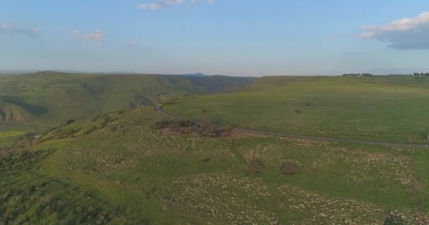 Aerial shot above Golan Heights and Taiberia in North of Israel. Open fields with green landscapes and mountains above Galilee sea or Kinnert at Jordan valley — Stock Video