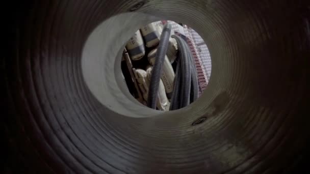 Swirl orbit shot on an empty tube pipe tunnel at construction site made of concrete, structure hole ready for work. — Stock Video