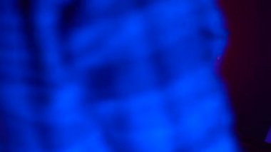 Futuristic concept: girl and family using augmented reality head set and controllers. Friendly team cheering and supporting while she is using virtual reality equipment