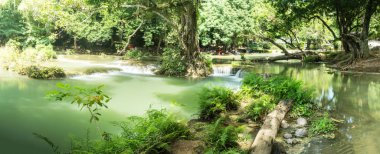 Chet Sao Noi Waterfall in tropical rainforest with rock and turquoise blue pond has 7 tiers, Seven leveled falls are one of most beautiful waterfalls in Thailand.  Namtok chet saonoi National Park