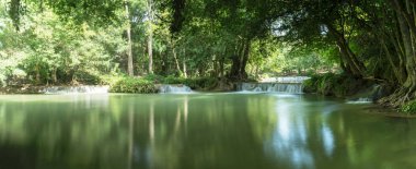 Chet Sao Noi Waterfall in tropical rainforest with rock and turquoise blue pond has 7 tiers, Seven leveled falls are one of most beautiful waterfalls in Thailand.  Namtok chet saonoi National Park