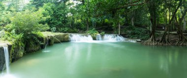 Chet Sao Noi Waterfall in tropical rainforest with rock and turquoise blue pond has 7 tiers, Seven leveled falls are one of most beautiful waterfalls in Thailand.  Namtok chet saonoi National Park
