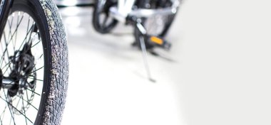 Close up wheel and chain of mountain biking. Landscape view of disc break system and front Derailleur of moutain bike. bicycle parts titanium color and frame aluminium. Shift lever and brake lever.