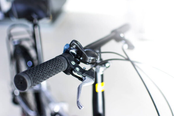 Close up wheel and chain of mountain biking. Landscape view of disc break system and front Derailleur of moutain bike. bicycle parts titanium color and frame aluminium. Shift lever and brake lever.