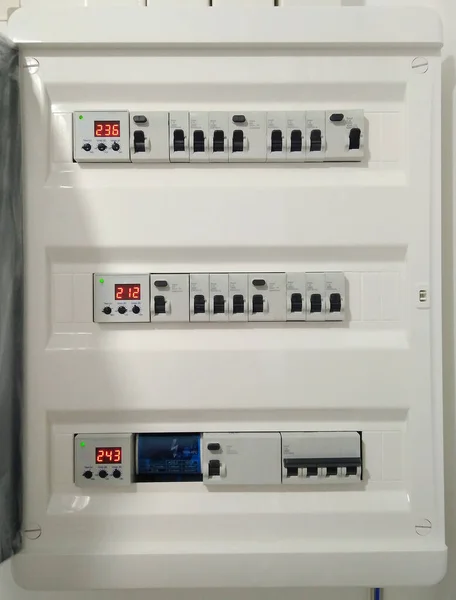 Automatic switches with wires in electrical shield close up. Electrical shield with automatic switches of electricity in the house - electricity control panel with circuit