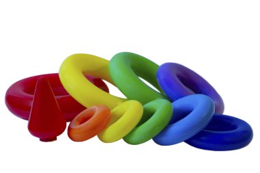 Children's plastic toy pyramid in a packing grid on a white background. Children's activity game for learning colors and shapes
