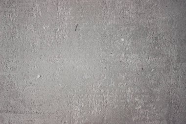 Duvarda beton ve alçı dokusu var. Alçıdaki dalgalı çizgiler. Beton ve alçı dokusu. Dekoratif alçı ya da alçı dokusu yakın, soyut gri taş arkaplan.