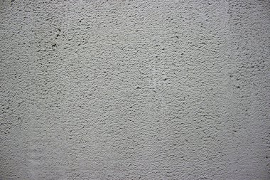 Duvarda beton ve alçı dokusu var. Alçıdaki dalgalı çizgiler. Beton ve alçı dokusu. Dekoratif alçı ya da alçı dokusu yakın, soyut gri taş arkaplan