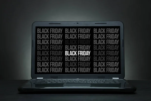 Laptop is on a black desk — Stock Photo, Image