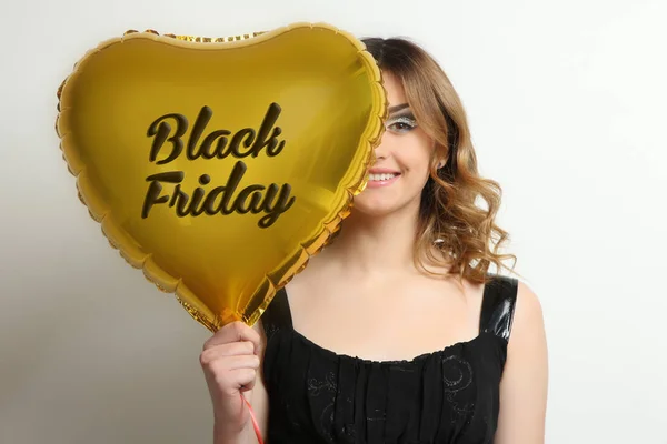 Girl with a golden balloon, Black Friday