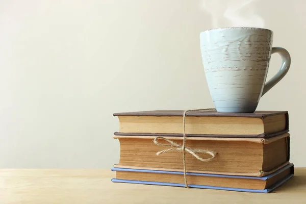 Stack of books and a cup of tea — Stock Photo, Image