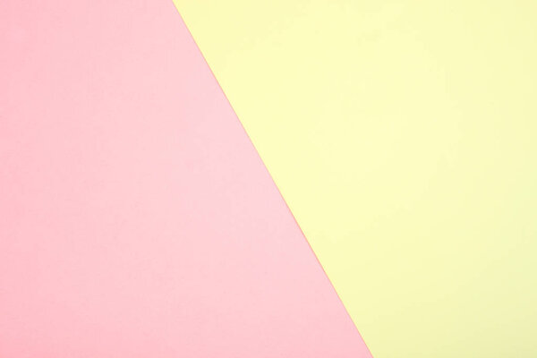 Background of pink and yellow paper pastel tones. Geometry