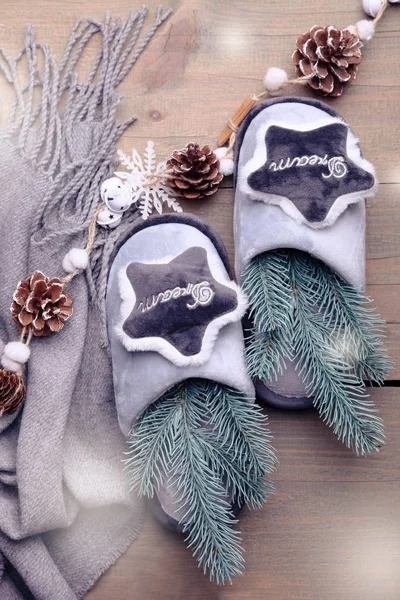 Gray soft home slippers and Christmas decor