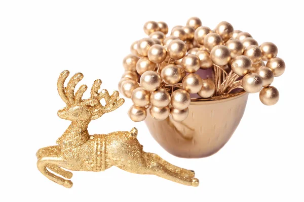 Deer and golden christmas decor in a cup — Stock Photo, Image