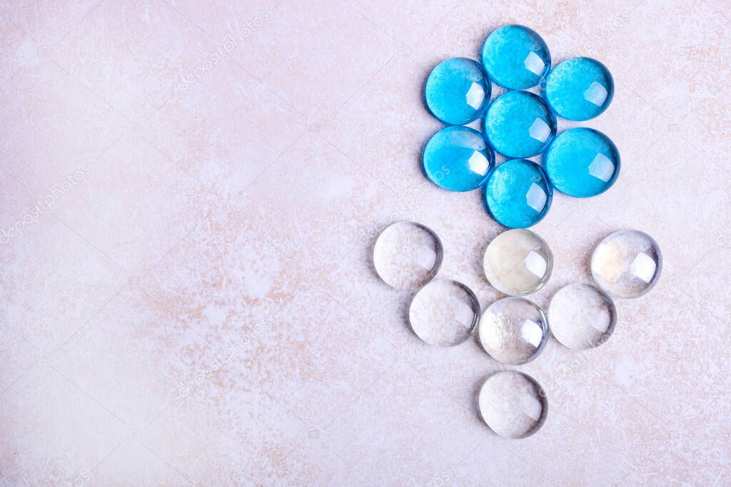 Glass decorative round pebbles on a white background.