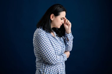 Woman dressed casually thinking