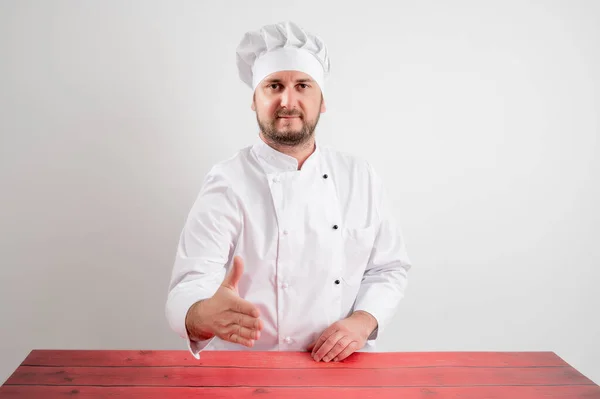 Ung Manlig Kock Vit Uniform Skakar Hand Poserar Vit Isolerad — Stockfoto