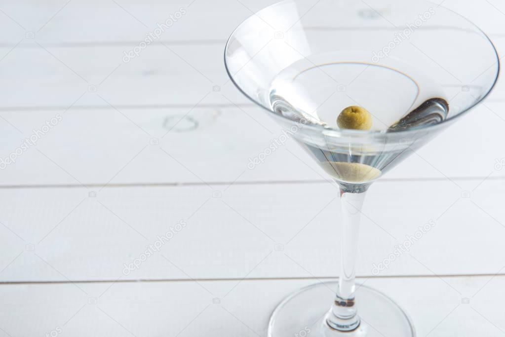 martini cocktail on wooden background close up