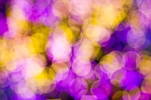 Resumen Amarillo púrpura luces fondo bokeh —  Fotos de Stock