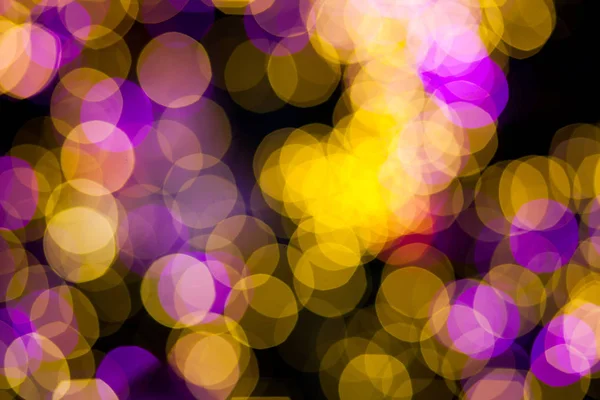 Abstraktní pozadí žlutá fialová bokeh světla — Stock fotografie