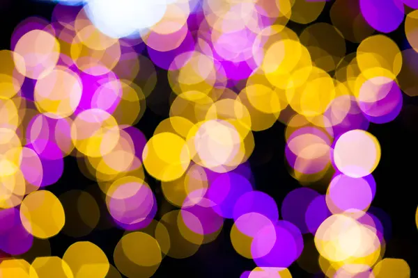 Abstrato amarelo roxo luzes bokeh fundo — Fotografia de Stock