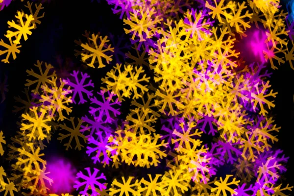 Abstract Yellow Purple lights snow flake bokeh background