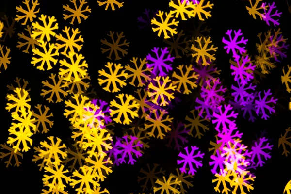 Abstract Yellow Purple lights snow flake bokeh background