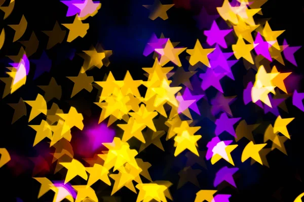 Abstrato Amarelo Roxo luzes Estrela bokeh fundo — Fotografia de Stock