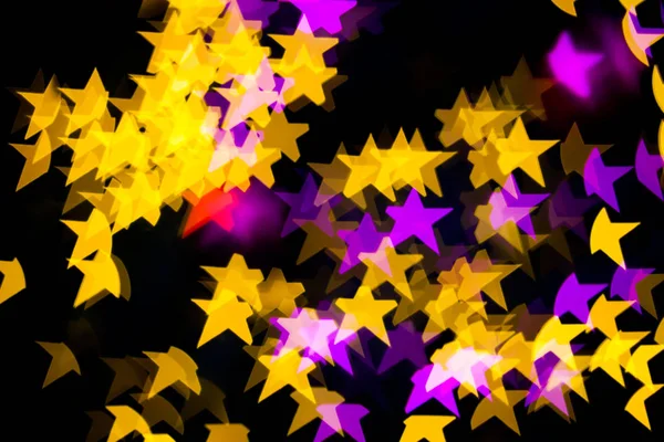 Аннотация Yellow Purple lights Star bokeh background — стоковое фото