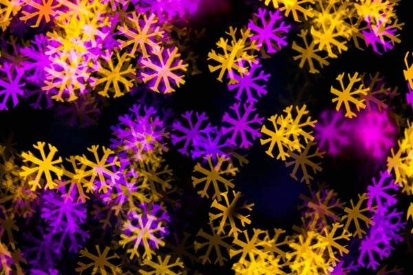 Abstract Yellow Purple lights snow flake bokeh background