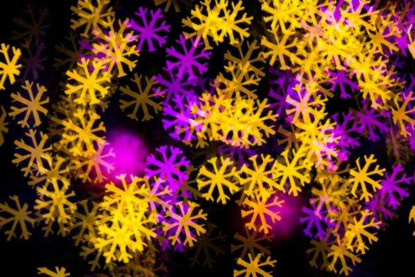 Abstract Yellow Purple lights snow flake bokeh background