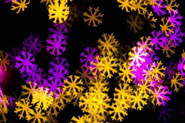 Abstract Yellow Purple lights snow flake bokeh background