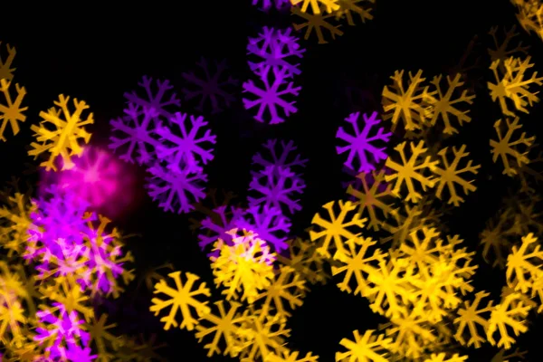 Abstract Yellow Purple lights snow flake bokeh background